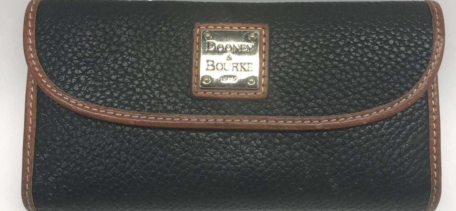 Dooney and Bourke Pebble Grain Clutch Wallet Black Leather with Brown Trim