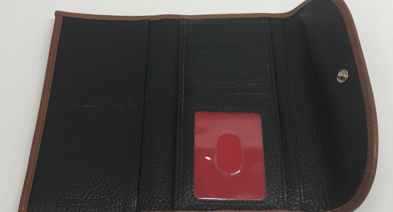 Dooney and Bourke Pebble Grain Clutch Wallet Black Leather with Brown Trim
