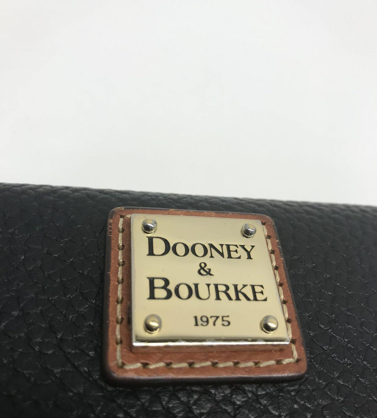 Dooney and Bourke Pebble Grain Clutch Wallet Black Leather with Brown Trim