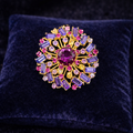 Vintage Austria Signed Gold Tone Rhinestone Brooch with Pink and Lavender Baguette Stones