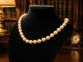 Gold Tone Cream Pearl Style Necklace with Decorative Clasp