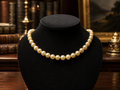 Gold Tone Cream Pearl Style Necklace with Crystal Accent Clasp