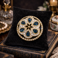 Museum Company Gold Tone Blue Teardrop Crystal Medallion Brooch | Pavé Rhinestone Statement Pin