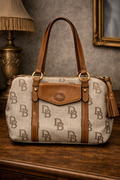 Dooney & Bourke DB Monogram Canvas Satchel Bag Leather Trim Tassel Barrel Shoulder Purse