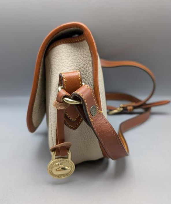 Vintage Dooney & Bourke Equestrian Tack Crossbody Bag | Cream Pebbled Leather Saddle Bag