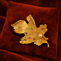 Capri Gold Tone Leaf Brooch with Multicolor Gemstones and Faux Pearl Accent