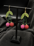 Pink Crystal Cherry Dangle Earrings with Green Leaf Accents and Gold Tone Hooks