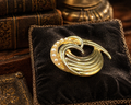 Trifari Gold Tone Swirl Brooch with Pearl Style Accents