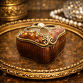 Mahogany tone enameled trinket box with jeweled quatrefoil lid and pearl accent