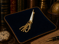 Gold tone umbrella brooch with white carved look panel and bead tassel detail
