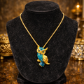 Gold tone owl pendant necklace with blue enamel detail