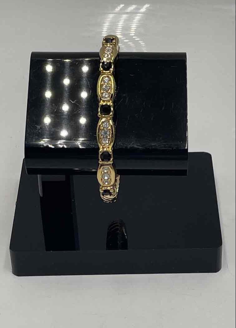Swarovski Gold-Tone Hinged Bangle Bracelet with Clear and Jet Crystal Accents