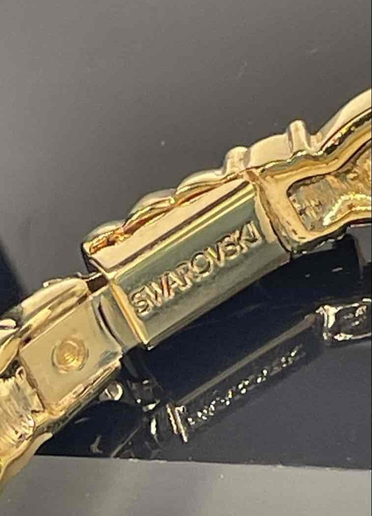 Swarovski Gold-Tone Hinged Bangle Bracelet with Clear and Jet Crystal Accents