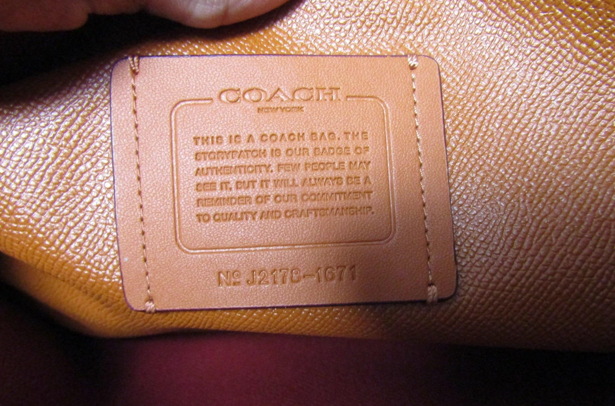Authenticated Coach salmon pebbled leather Mollie tote bag. Zipper is Broken
