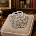 Vintage 1962 Sarah Coventry Tailored Swirl Silver Tone Brooch Mid-Century Pin