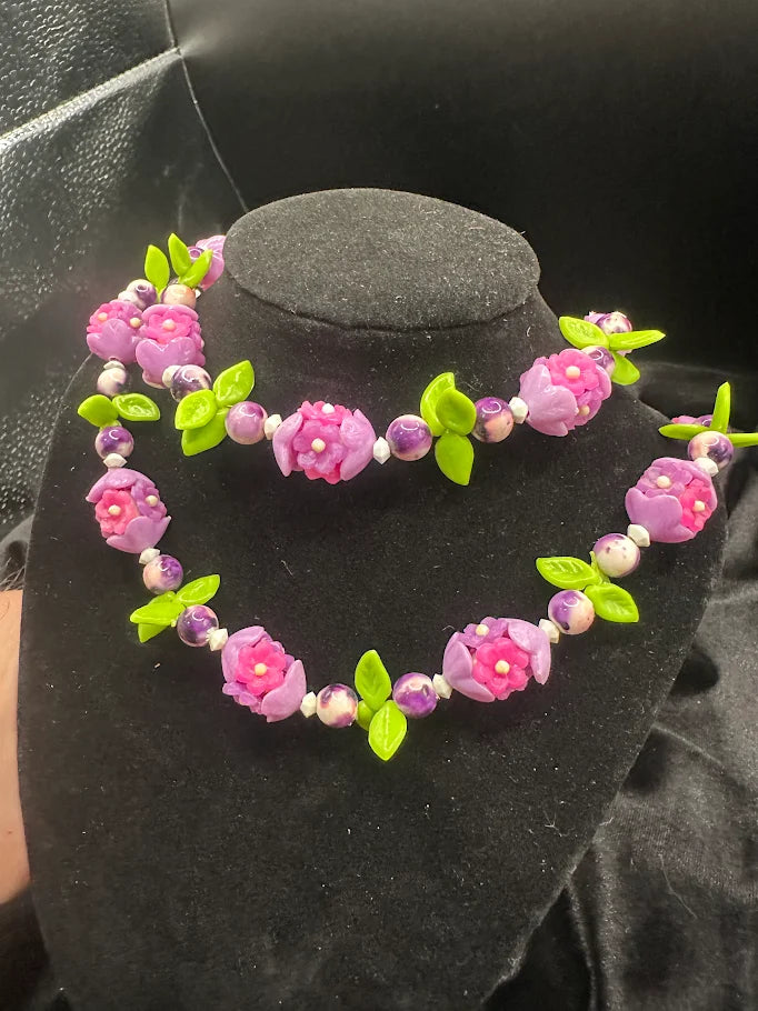 Pink and Purple Flower Bead Necklace with Green Leaf Accents  Description