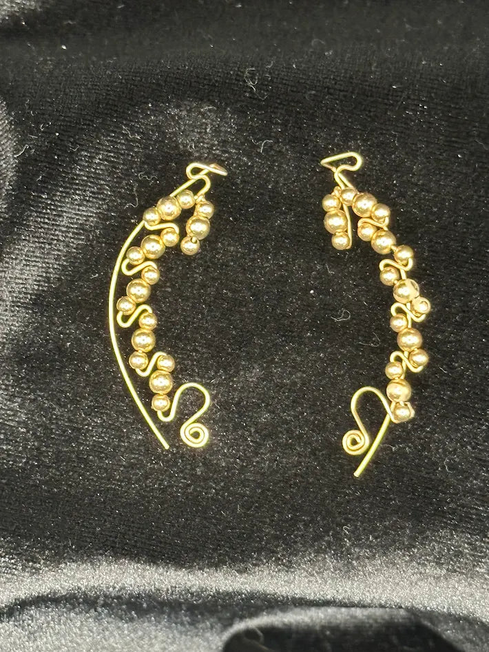 Gold tone bead swirl wire earrings with curved drop design