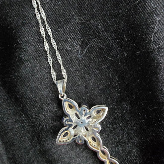 Silver tone cross pendant necklace with lavender crystal stones