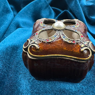 Mahogany tone enameled trinket box with jeweled quatrefoil lid and pearl accent