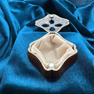 Mahogany tone enameled trinket box with jeweled quatrefoil lid and pearl accent