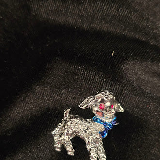 Silver Tone Lamb Brooch With Textured Finish And Blue Bow Detail