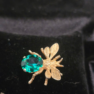 CINI gold tone insect brooch with green crystal bodySigned CINI Sterling Silver Vermeil Bee Brooch with Emerald Green Faceted Stone, Mid Century Designer Insect Pin