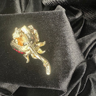 Vintage Monet Gold-Tone Red Rhinestone Rose Brooch with Green Enamel Leaves