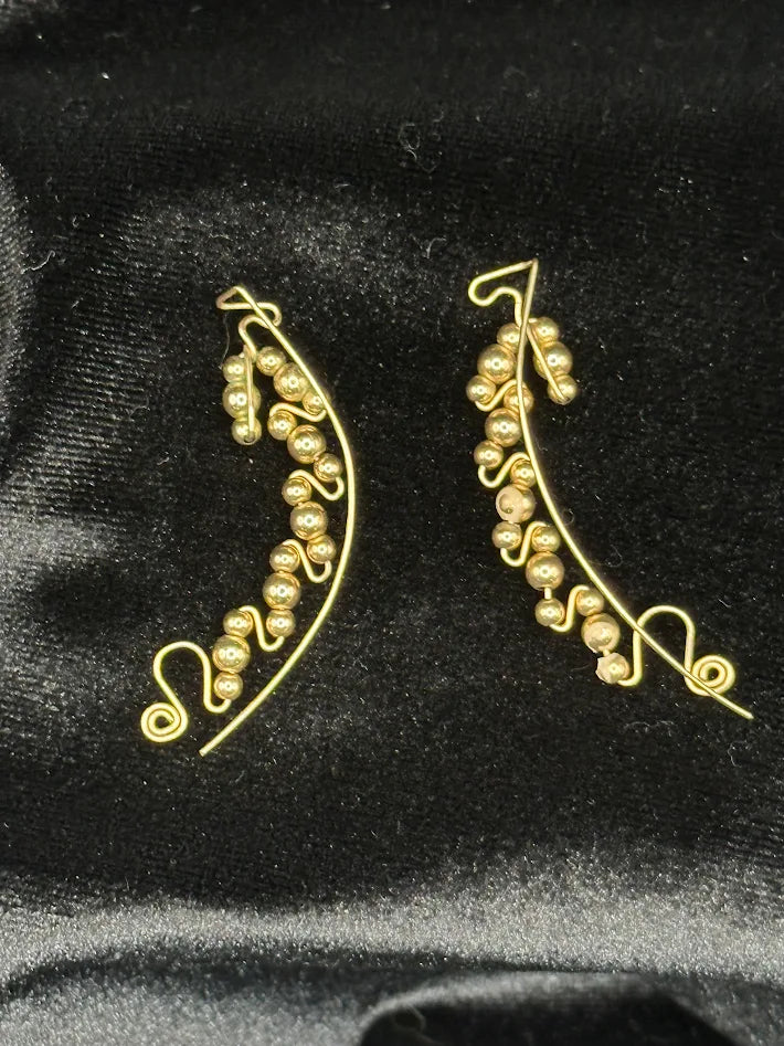 Gold tone bead swirl wire earrings with curved drop design