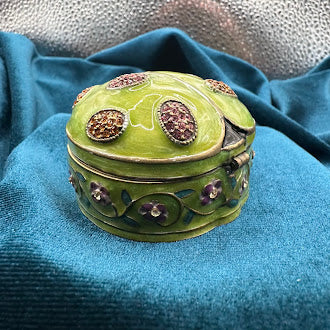 Green ladybug trinket box with floral trim and rhinestone accents