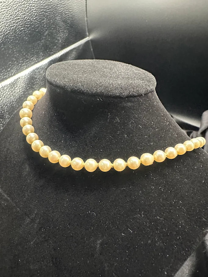 Gold Tone Cream Pearl Style Necklace with Crystal Accent Clasp