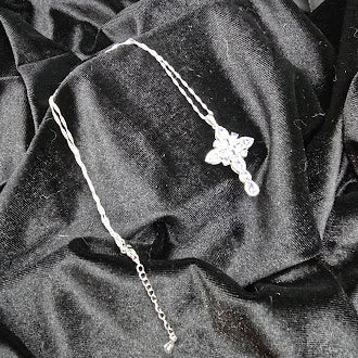 Silver tone cross pendant necklace with lavender crystal stones