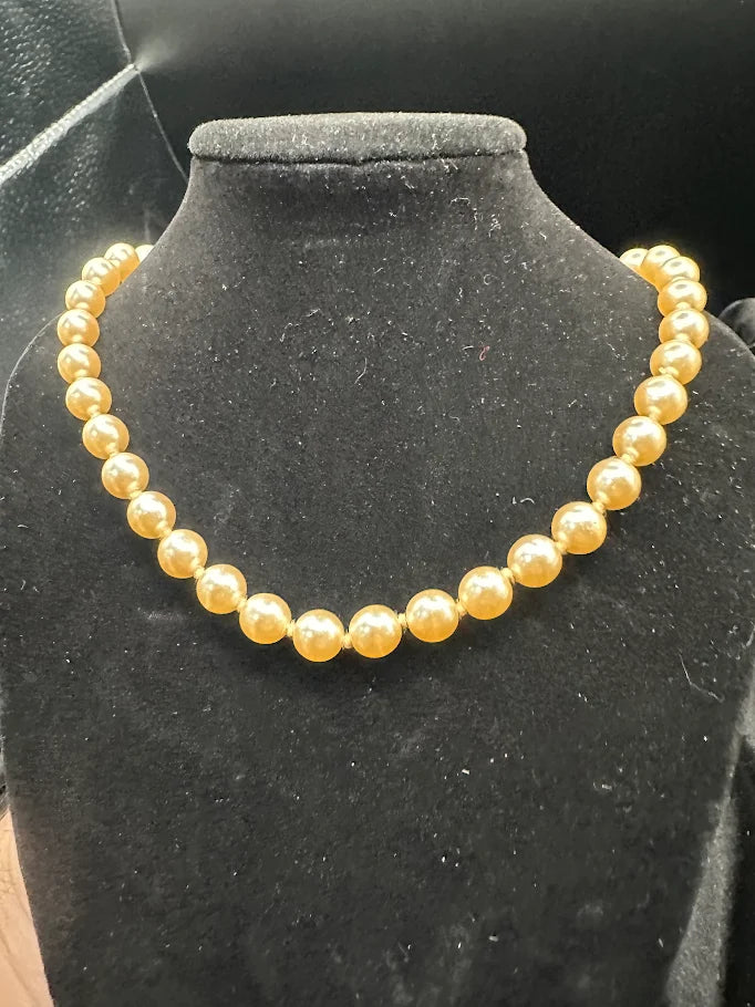 Gold Tone Cream Pearl Style Necklace with Decorative Clasp