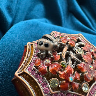 Gold tone ladybug enameled trinket box with rhinestone accents UV reactive