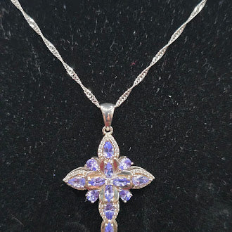 Silver tone cross pendant necklace with lavender crystal stones