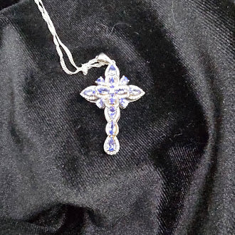 Silver tone cross pendant necklace with lavender crystal stones