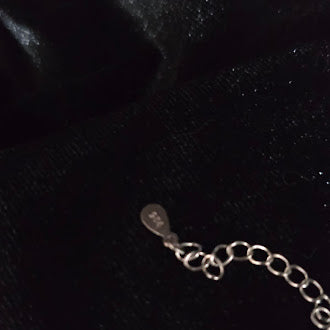 Silver tone cross pendant necklace with lavender crystal stones
