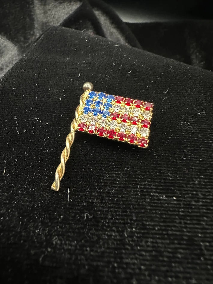 Eisenberg Ice gold tone American flag brooch with red white and blue crystals