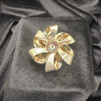 Gold Tone Pink Crystal Pinwheel Brooch Textured Ribbon Swirl Design