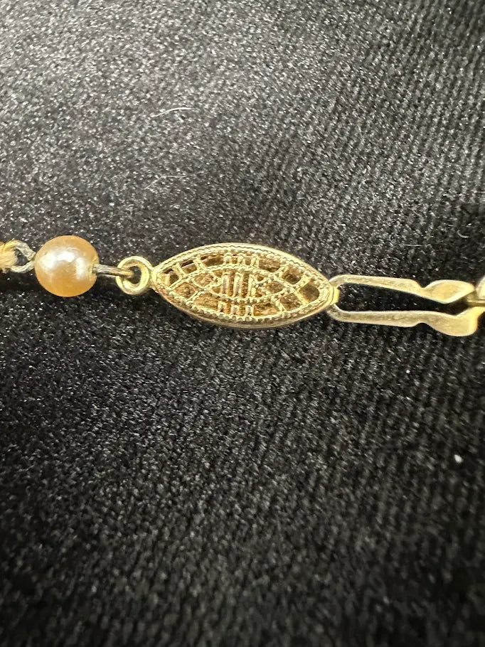 Gold Tone Cream Pearl Style Necklace with Decorative Clasp