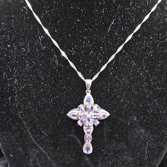 Silver tone cross pendant necklace with lavender crystal stones