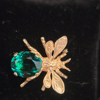 CINI gold tone insect brooch with green crystal bodySigned CINI Sterling Silver Vermeil Bee Brooch with Emerald Green Faceted Stone, Mid Century Designer Insect Pin